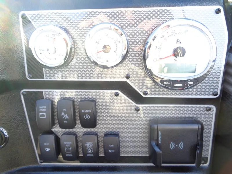 Slide: The Image of Dashboard of 2025 Lund 1875 Tyee boat with gauges and control switches. - 23