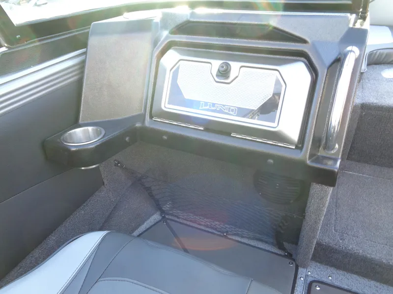 Slide: The Image of Interior of 2025 Lund 1875 Tyee boat with storage compartment and cup holder. - 24