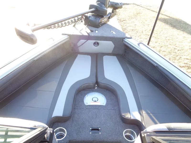 Slide: The Image of 2025 Lund 1875 Tyee boat interior with gray seating and modern design. - 26