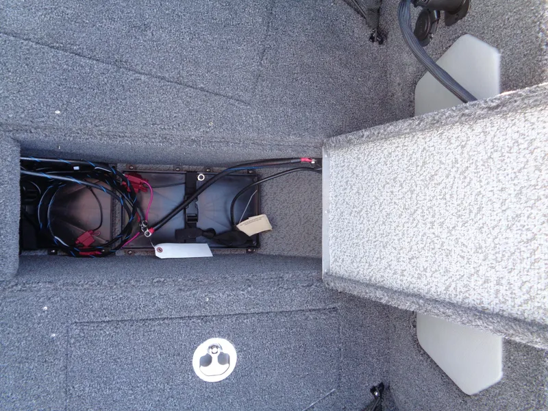 Slide: The Image of Interior view of 2025 Lund 1875 Tyee boat showing wiring and storage compartment. - 31