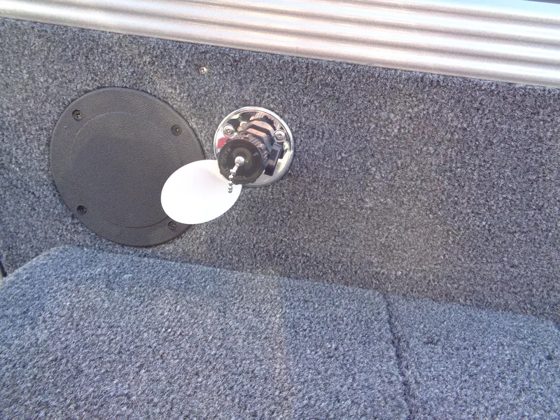 Slide: The Image of 2025 Lund 1875 Tyee boat interior with speaker and fuel cap detail. - 33