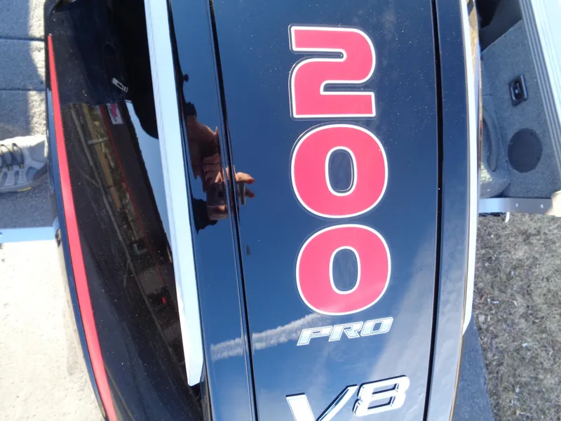 Slide: The Image of Close-up of 2025 Lund 1875 Tyee V8 engine with '200 Pro' label. - 8