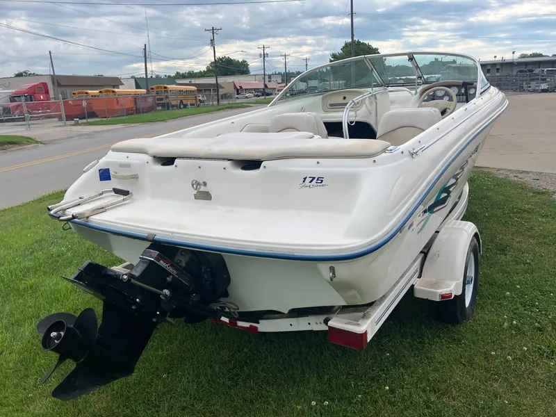 Slide: The Image of 1996 Sea Ray 175 Open Bow boat on trailer, parked on grass. - 7