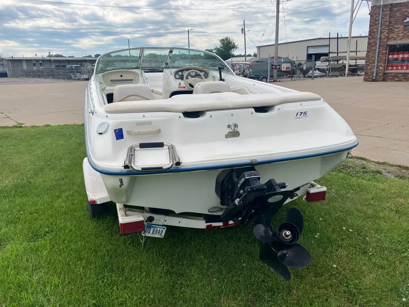 Slide: The Image of 1996 Sea Ray 175 Open Bow boat on trailer, parked on grass. - 6