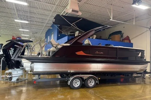 The Image of 2026 Barletta L25MA pontoon boat displayed indoors on a trailer. - 0
