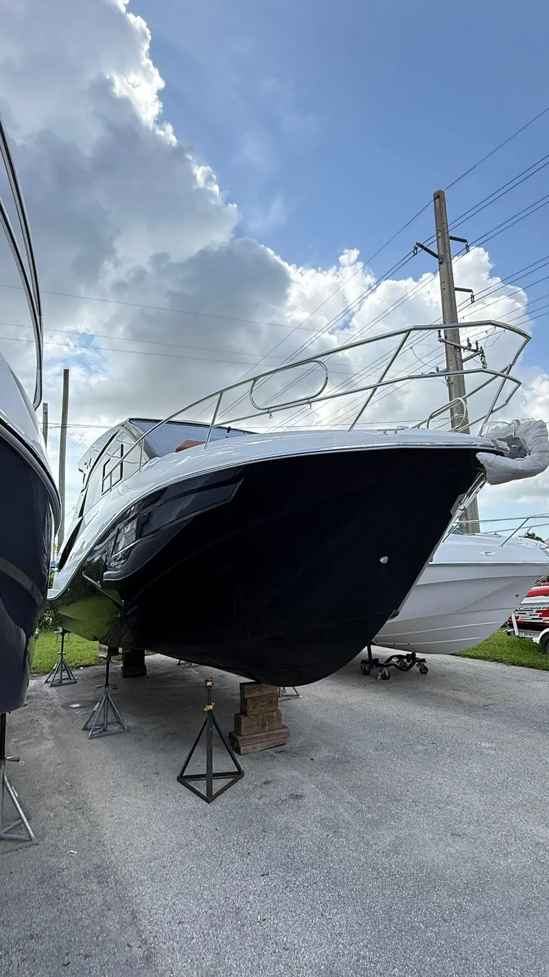The Image of 2025 NX Boats NX370 HT yacht on display under a cloudy sky. - 1