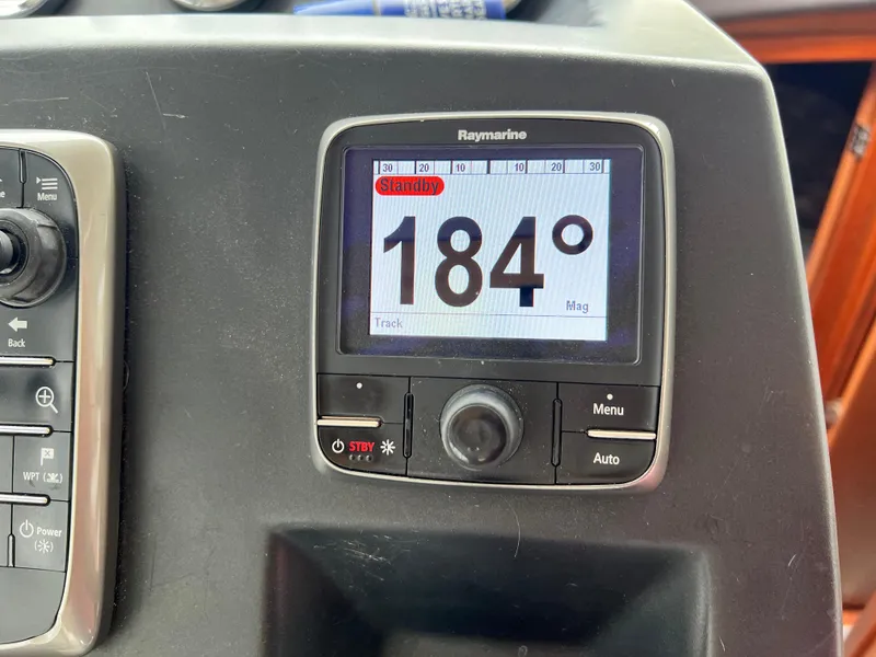 Slide: The Image of Navigation display on 2017 Jeanneau NC11 boat showing coordinates and controls. - 33