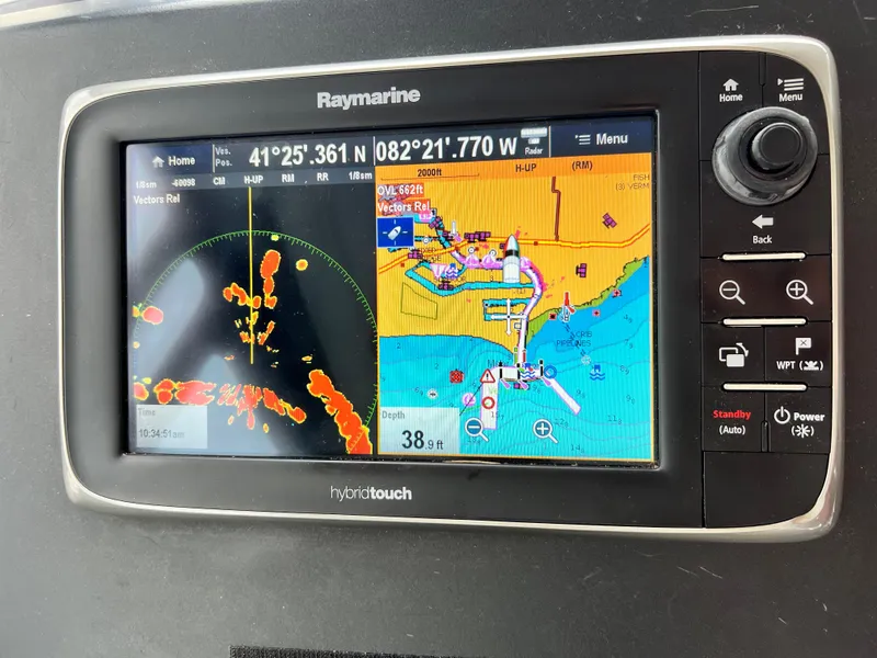 Slide: The Image of Control panel of a 2017 Jeanneau NC11 boat with navigation screens and gauges. - 34
