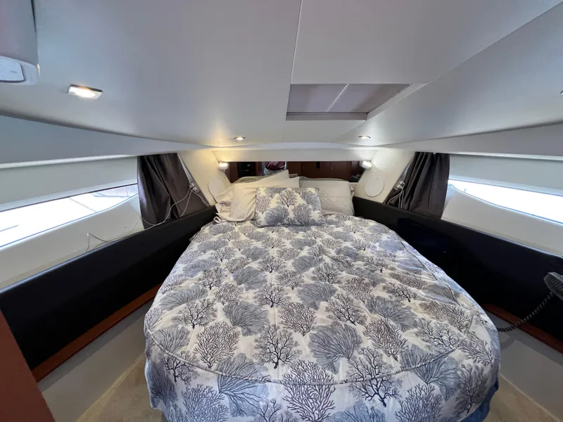 Slide: The Image of 2017 Jeanneau NC11 cabin with cozy bed and modern interior design. - 40