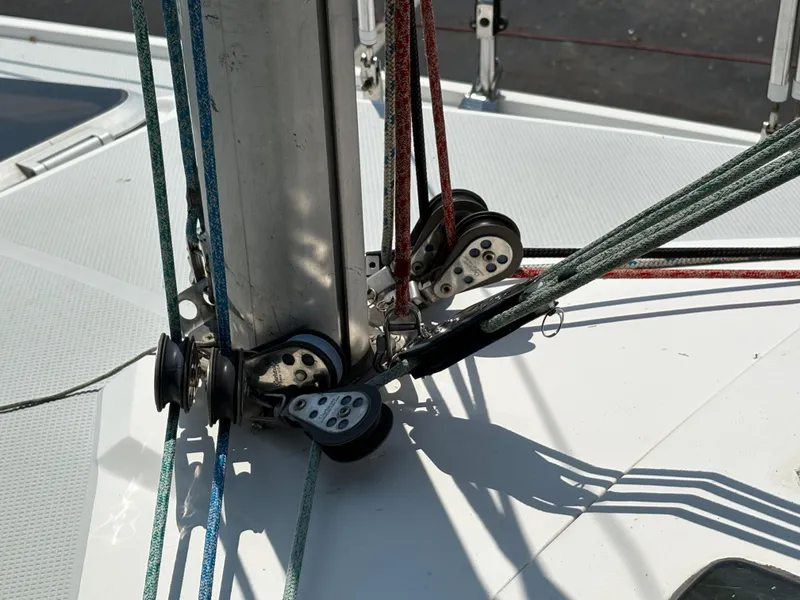Slide: The Image of Close-up of Catalina 270 LE 1994 sailboat rigging and pulleys on deck. - 11