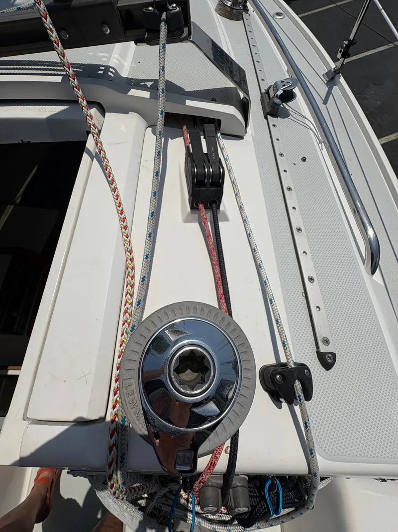 Slide: The Image of Close-up of Catalina 270 LE sailboat deck, featuring winch and colorful ropes, 1994 model. - 13