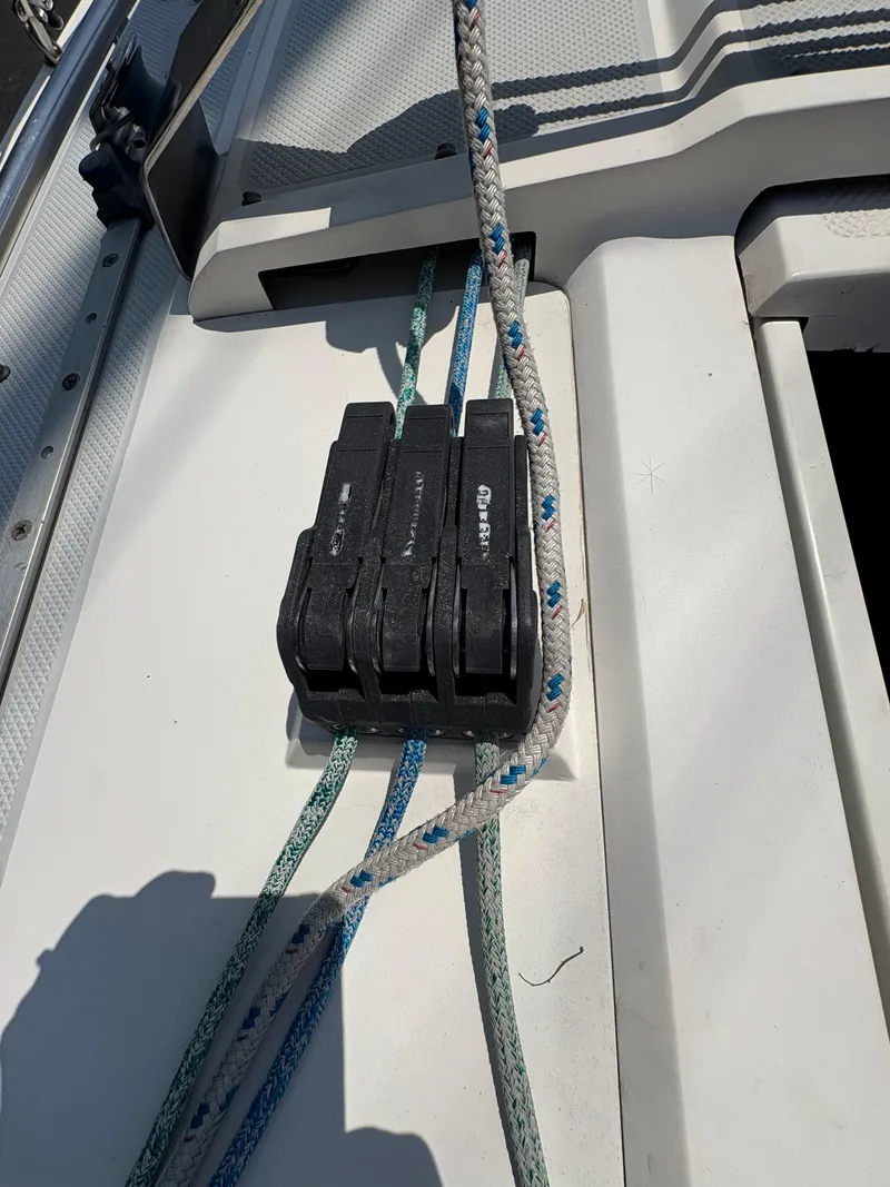 Slide: The Image of Deck of 1994 Catalina 270 LE sailboat with rope clutches and lines. - 14