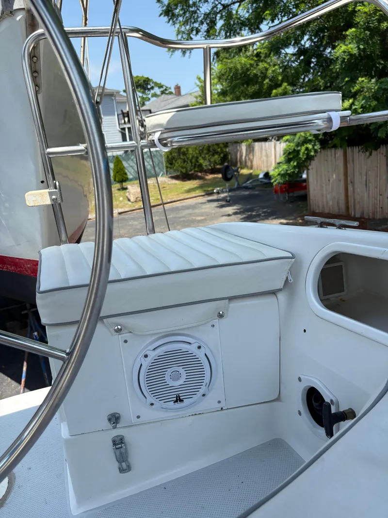 Slide: The Image of Cockpit of 1994 Catalina 270 LE sailboat with steering wheel and seating. - 26