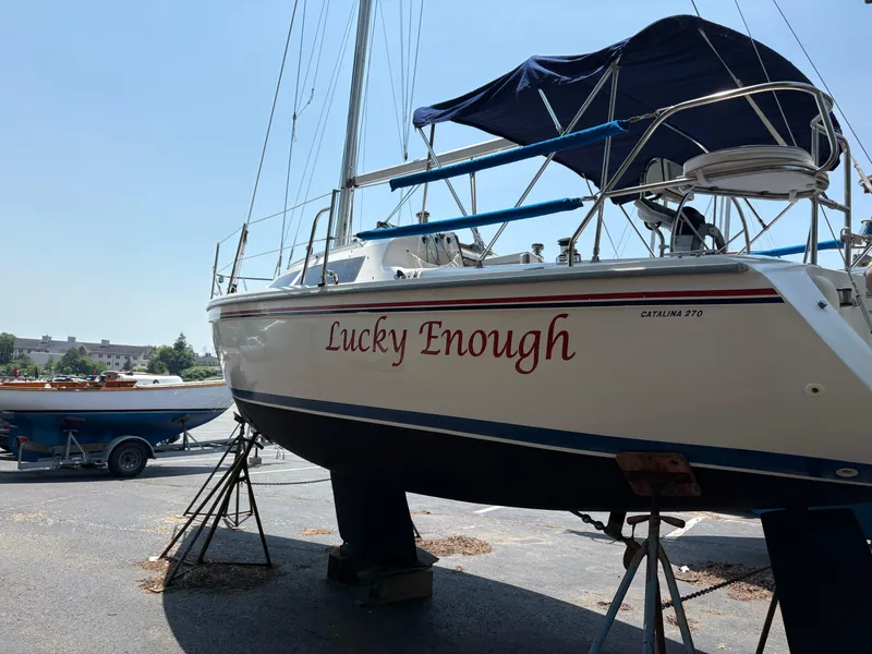Slide: The Image of 1994 Catalina 270 LE sailboat named "Lucky Enough" on dry dock. - 8