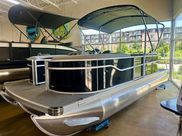 The Image of 2026 Barletta A20L pontoon boat displayed indoors with canopy and sleek design. - 0