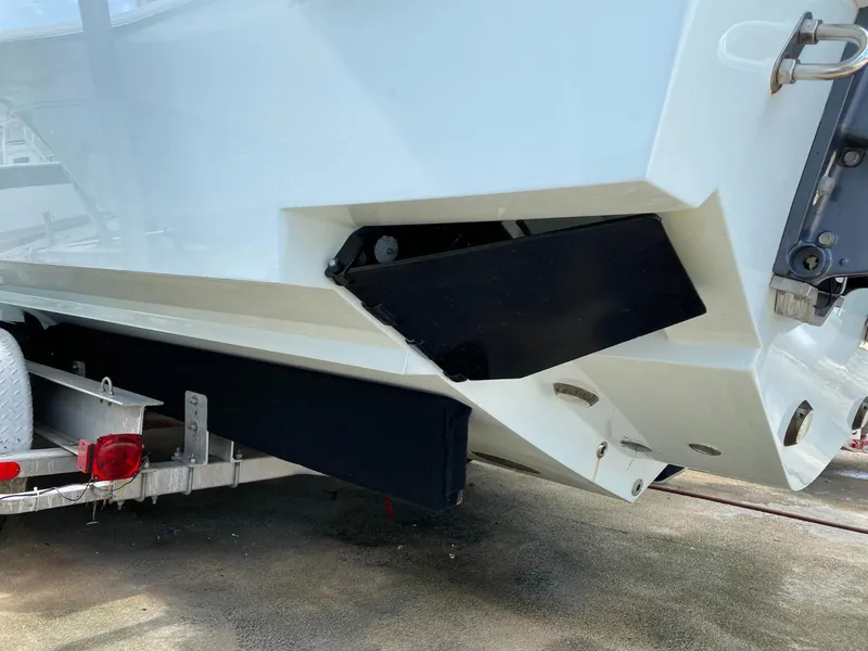 Slide: The Image of 2017 Contender 35 Tournament boat on trailer, showing hull and trim tab details. - 10