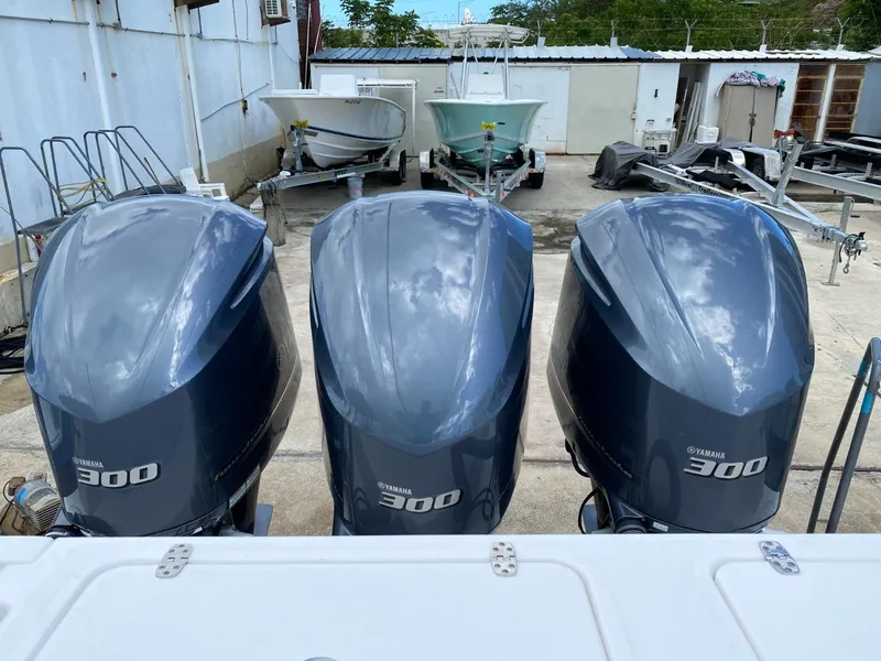Slide: The Image of Three Yamaha 300 outboard motors on a 2017 Contender 35 Tournament boat. - 12