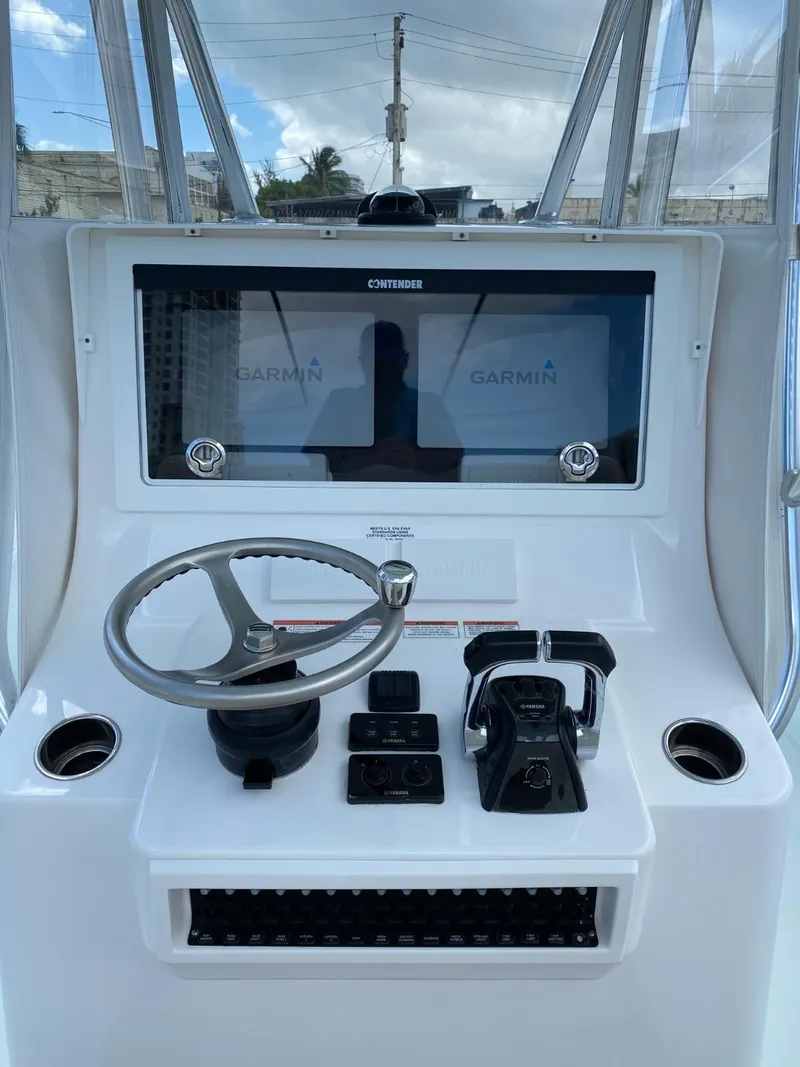 Slide: The Image of Helm of 2017 Contender 35 Tournament boat with Garmin displays and controls. - 14