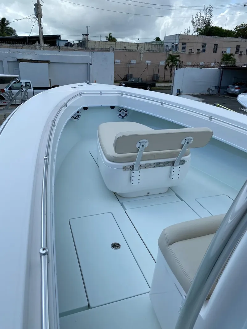 Slide: The Image of 2017 Contender 35 Tournament boat interior with seating and storage compartments. - 17