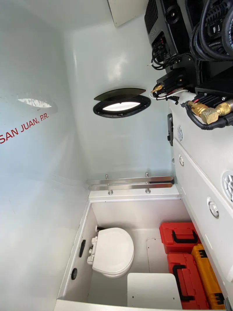 Slide: The Image of Interior of 2017 Contender 35 Tournament boat with toilet and storage, San Juan, P.R. - 19