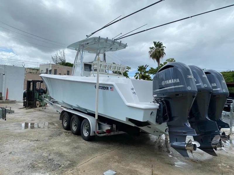Slide: The Image of 2017 Contender 35 Tournament boat with triple Yamaha 300 engines on a trailer. - 2