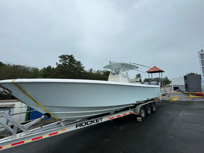 Slide: The Image of 2017 Contender 35 Tournament boat on trailer, parked outdoors. - 3