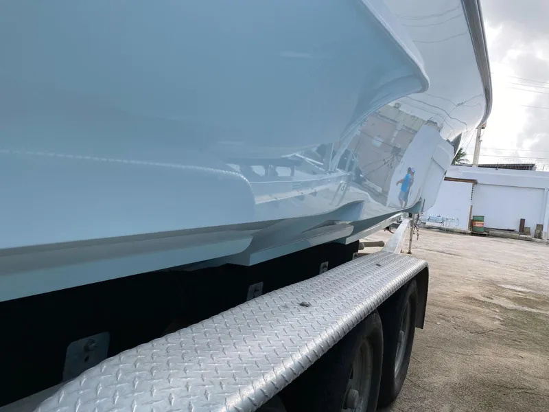 Slide: The Image of 2017 Contender 35 Tournament boat on trailer, side view. - 5