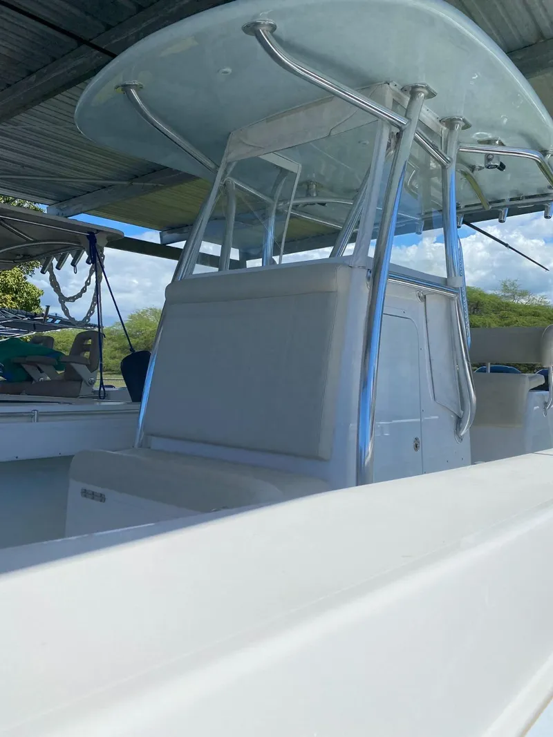 Slide: The Image of 2017 Contender 35 Tournament boat with T-top under a canopy. - 8