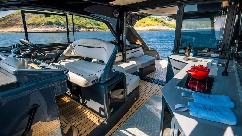 Slide: The Image of Luxurious interior of 2025 NX Boats NX44 PININFARINA yacht with modern amenities and scenic ocean view. - 12