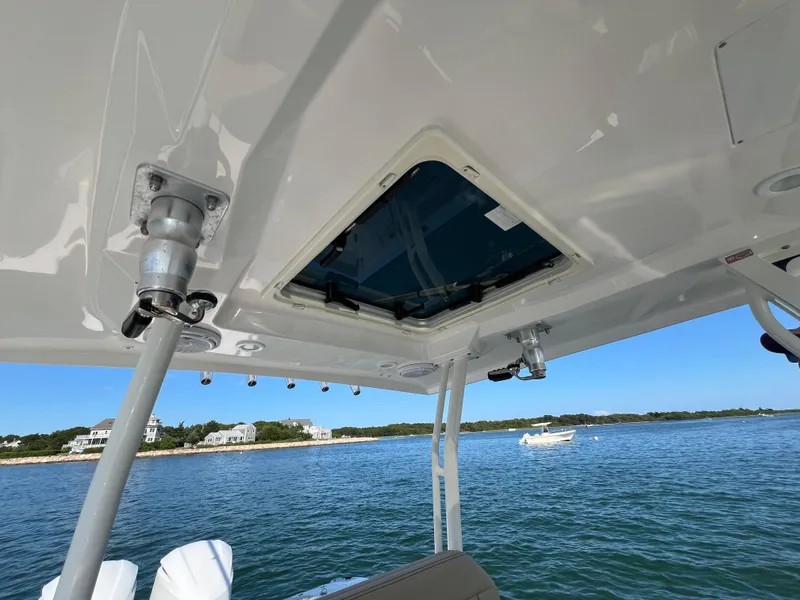 Slide: The Image of 2019 Pursuit S 288 boat roof view with ocean and shoreline background. - 13