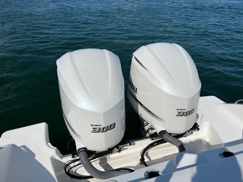 Slide: The Image of Twin Yamaha 300 outboard engines on a 2019 Pursuit S 288 boat. - 18