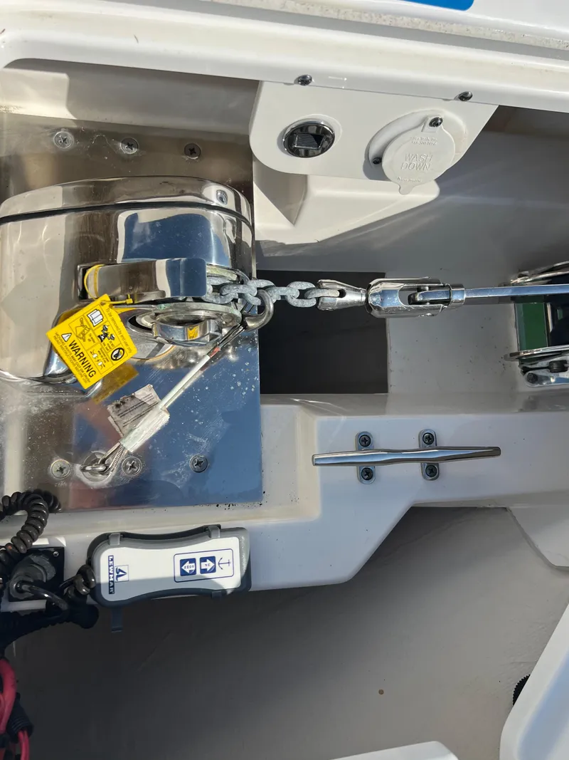 Slide: The Image of 2019 Pursuit S 288 boat anchor system with chain and warning label. - 21
