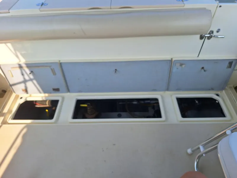 Slide: The Image of aft deck live well; storage and transom door to swim platform - 12