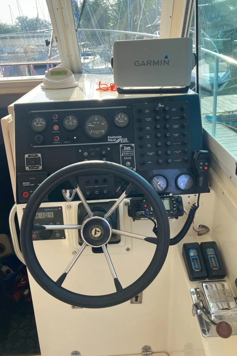 Slide: The Image of helm with Garmin GPS, gauges and bow thruster controls - 17