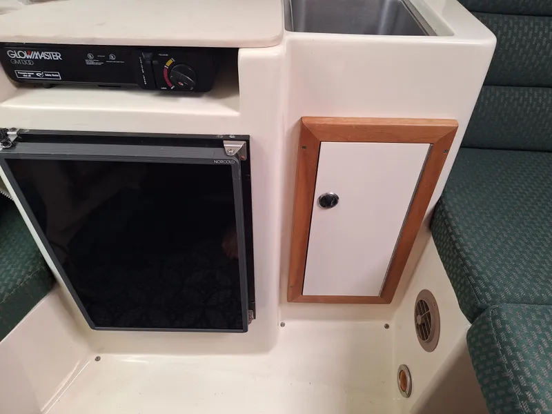 Slide: The Image of galley under counter stove and refrigerator - 6