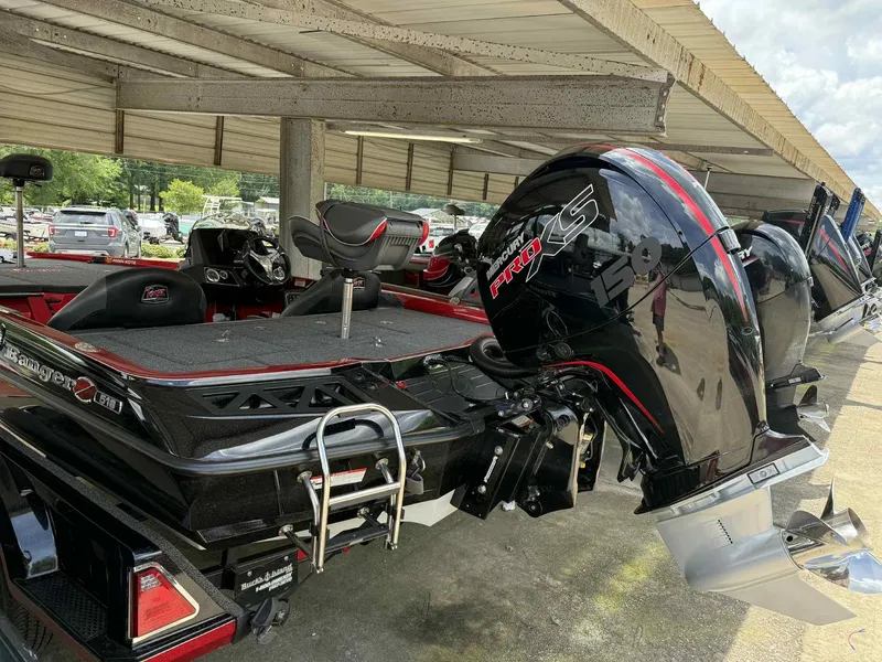Slide: The Image of 2022 Ranger Z518 boat with Mercury Pro XS engine, parked under a shelter. - 3