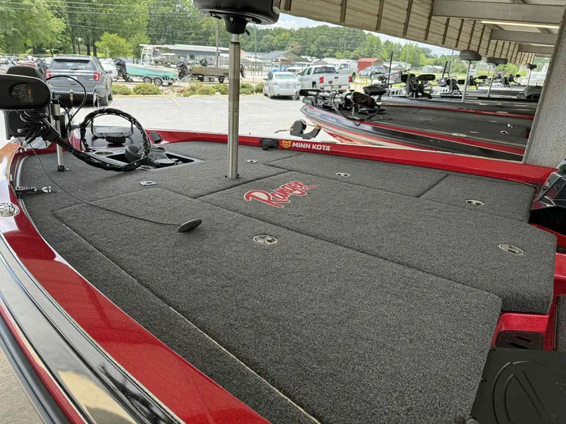 Slide: The Image of 2022 Ranger Z518 boat deck with Minn Kota trolling motor in a parking area. - 5