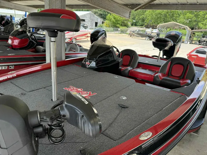 Slide: The Image of 2022 Ranger Z518 boat with Minn Kota trolling motor and red-black seating under a shelter. - 7