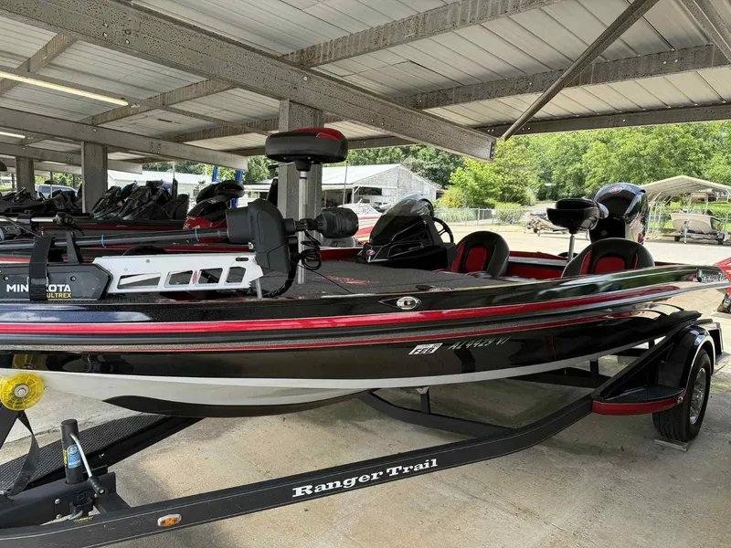 Slide: The Image of 2022 Ranger Z518 boat with Minn Kota Ultrex motor in covered storage. - 9