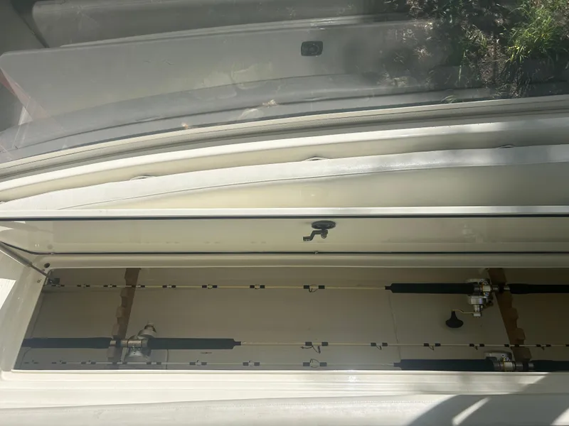 Slide: The Image of Open storage compartment on a 1996 Tides 27 boat, showing interior details. - 24
