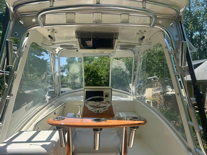 Slide: The Image of Interior view of a 1996 Tides 27 boat cockpit with steering wheel and controls. - 6