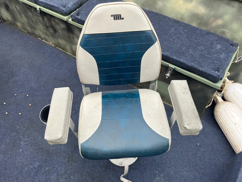 Slide: The Image of Steven Custom JON EXTRA WIDE 2012 boat seat with blue and white upholstery on deck. - 21