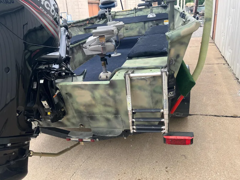 Slide: The Image of Boat with Mercury outboard motor and ladder, Steven Custom JON EXTRA WIDE, 2012 model. - 24