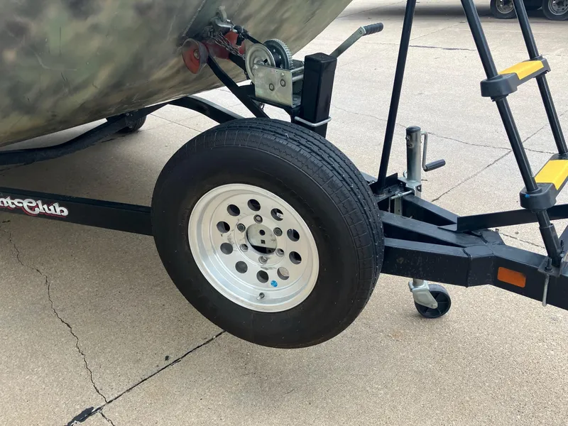 Slide: The Image of Trailer wheel and hitch of a 2012 Steven Custom JON EXTRA WIDE boat trailer. - 26