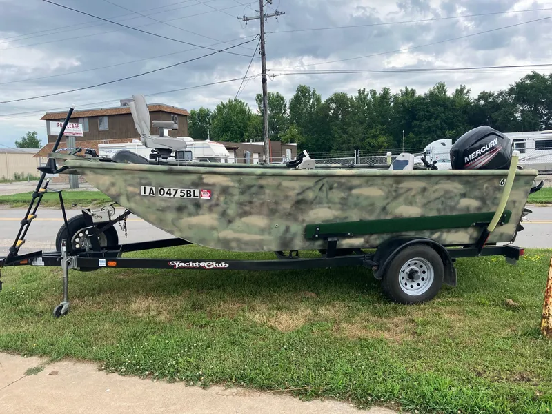 Slide: The Image of 2012 Steven Custom JON EXTRA WIDE boat on trailer, camo design, Mercury motor. - 3