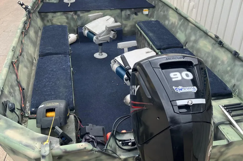 Slide: The Image of Interior of a 2012 Steven Custom JON EXTRA WIDE boat with Mercury 90 engine. - 30