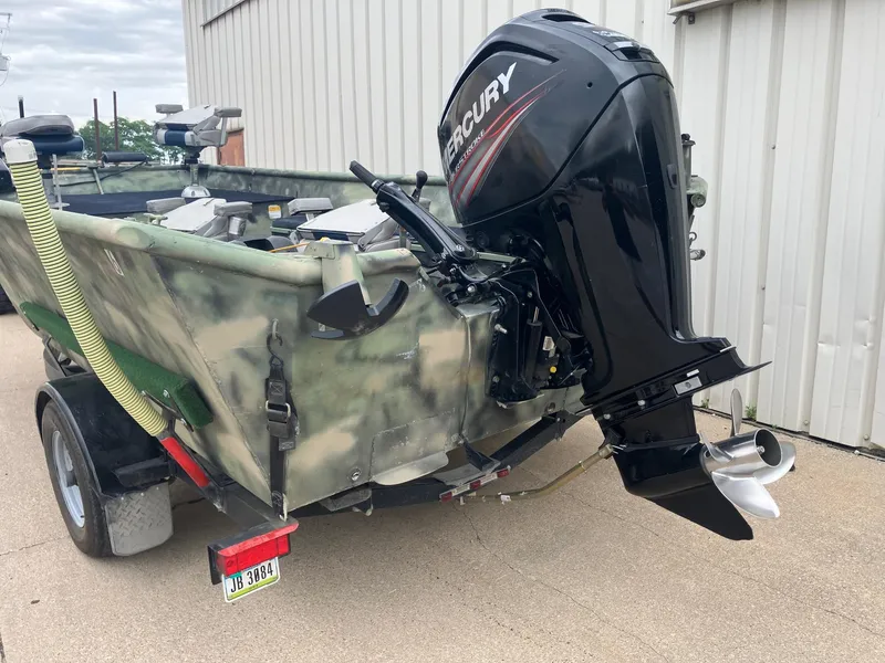 Slide: The Image of 2012 Steven Custom JON EXTRA WIDE boat with Mercury outboard motor, camo design. - 4