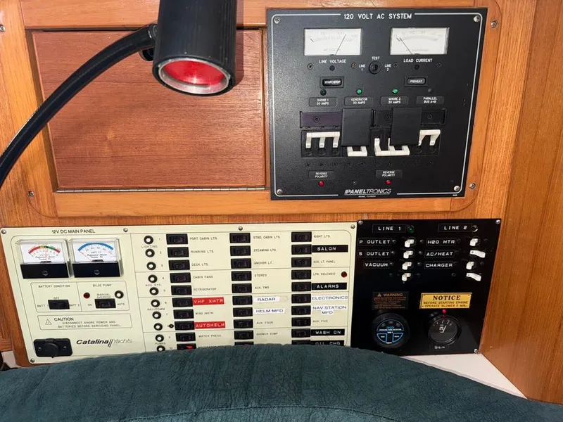 Slide: The Image of Electrical control panel of a 1998 Catalina 42Mk 2 yacht, featuring AC and DC systems. - 10