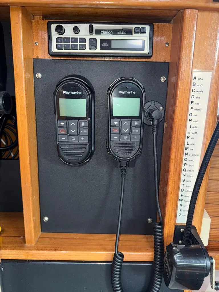 Slide: The Image of Control panel of a 1998 Catalina 42Mk 2 with Raymarine devices and Clarion M8430 radio. - 12