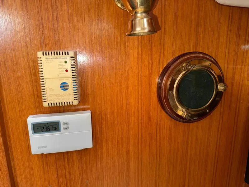 Slide: The Image of Wooden interior of 1998 Catalina 42Mk 2 with carbon monoxide alarm and thermostat. - 13